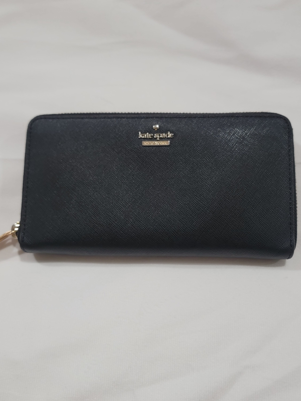 kate spade black zip-around Saffiano leather wallet with gold logo